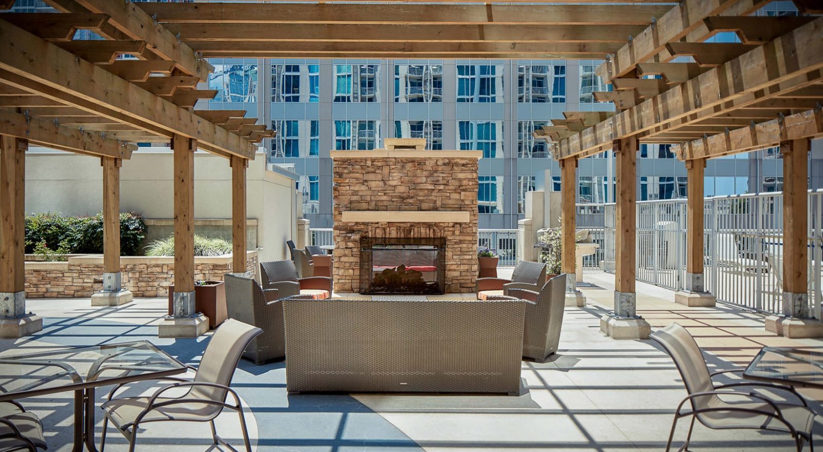 Rooftop fireplace lounge at Catalyst with Uptown Charlotte behind